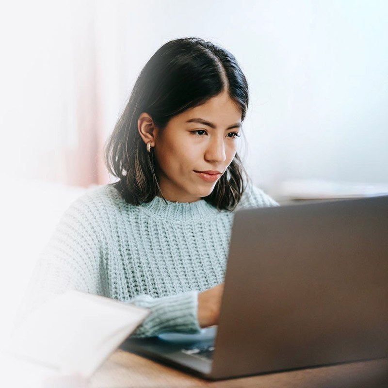 RW-Virtual-Assistant-800 Filipino virtual assistant working remotely on a laptop. Remote Work Philippines.